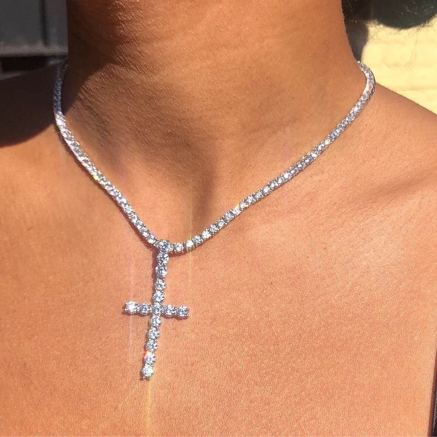 Diamond-encrusted cross pendant necklace.