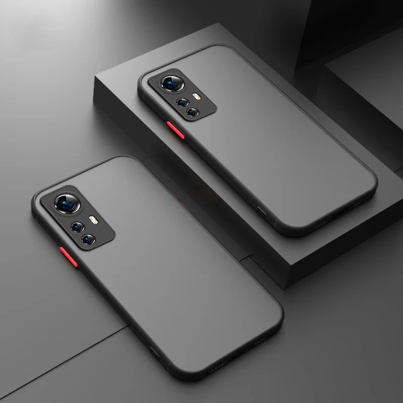 Sleek, dark gray smartphone cases with prominent camera cutouts and red accents.